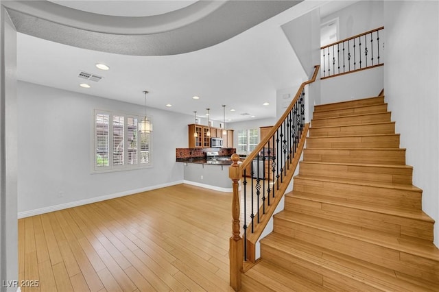 2432 Granada Bluff Ct, Las Vegas, NV 89135 - stairway with wood finished floors, baseboards, and recessed lighting
