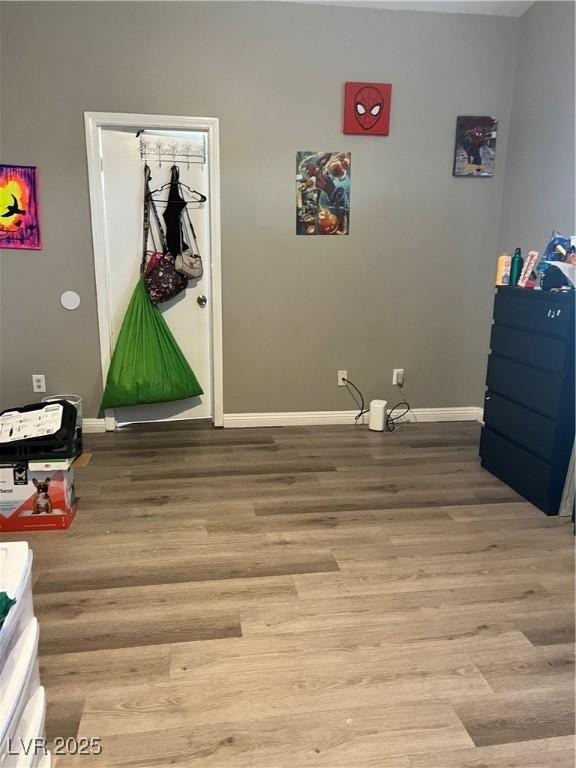 playroom with light wood-style floors and baseboards