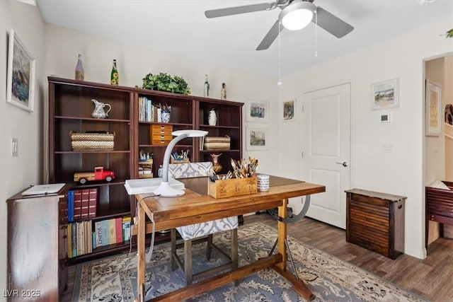 office area with wood finished floors and a ceiling fan