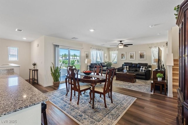 dining space with dark wood-style flooring, stairway, a ceiling fan, recessed lighting, and baseboards
