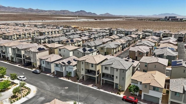 aerial perspective of suburban area featuring a mountainous background