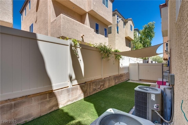 view of yard featuring fence and cooling unit