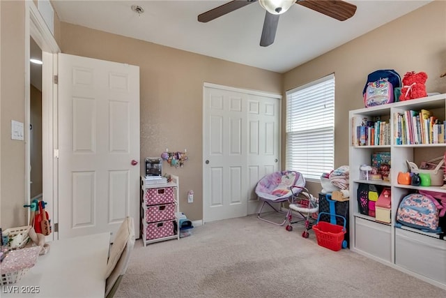 rec room with carpet floors, ceiling fan, and baseboards