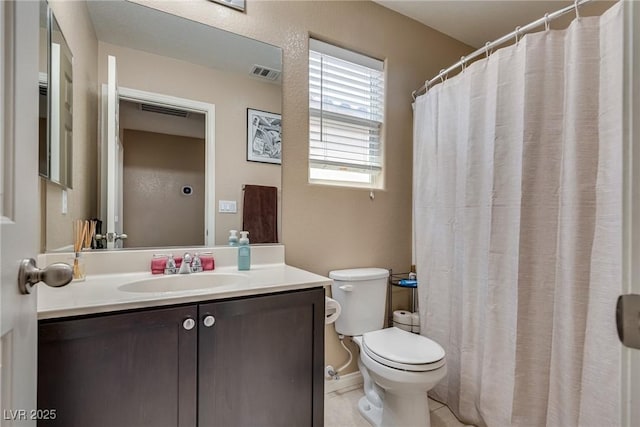 bathroom featuring toilet, vanity, tile patterned floors, and a shower with shower curtain
