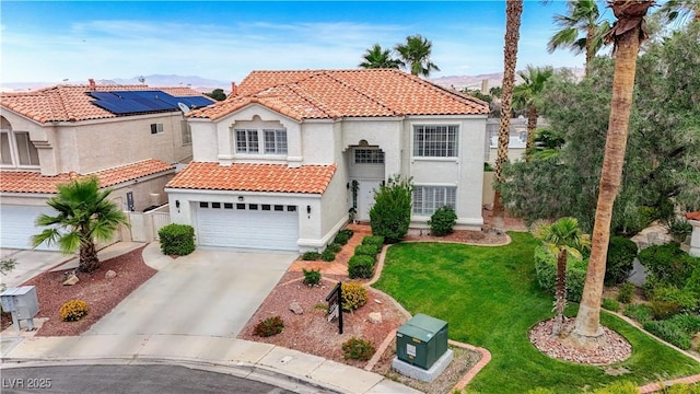 4 Tarryall Ter, Henderson, NV 89074 - mediterranean / spanish home featuring a tile roof, stucco siding, driveway, an attached garage, and a mountain view