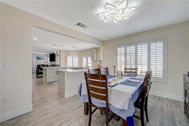 4 Tarryall Ter, Henderson, NV 89074 - dining space featuring a chandelier, light wood-style flooring, and recessed lighting