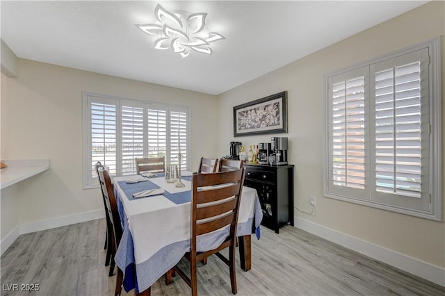 4 Tarryall Ter, Henderson, NV 89074 - dining area with light wood-style flooring and baseboards