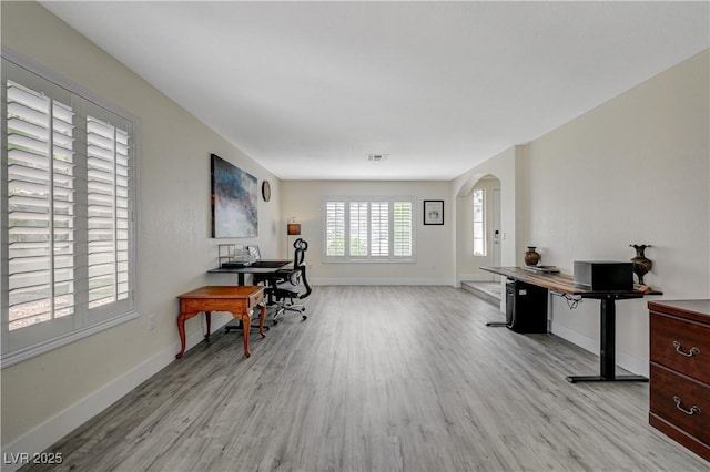 4 Tarryall Ter, Henderson, NV 89074 - office featuring light wood-style floors, arched walkways, and baseboards