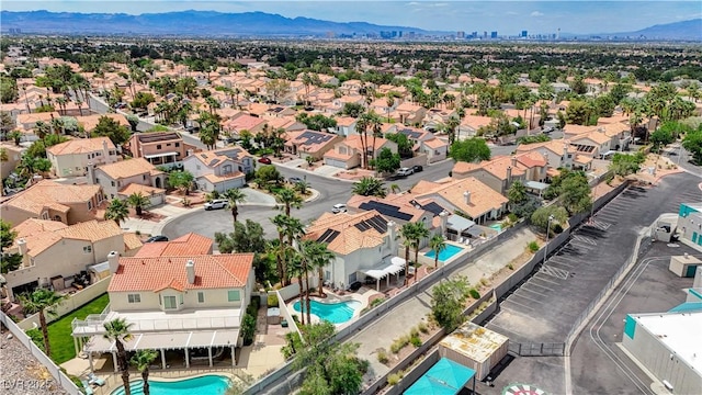 4 Tarryall Ter, Henderson, NV 89074 - aerial view of residential area with a pool and a mountain backdrop