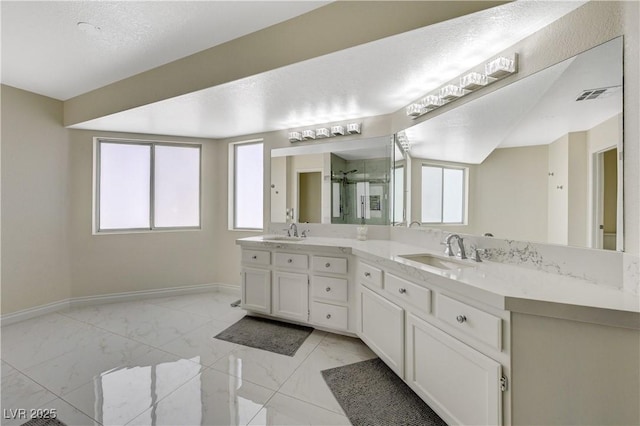 4 Tarryall Ter, Henderson, NV 89074 - bathroom with double vanity, marble finish floors, baseboards, and a shower stall