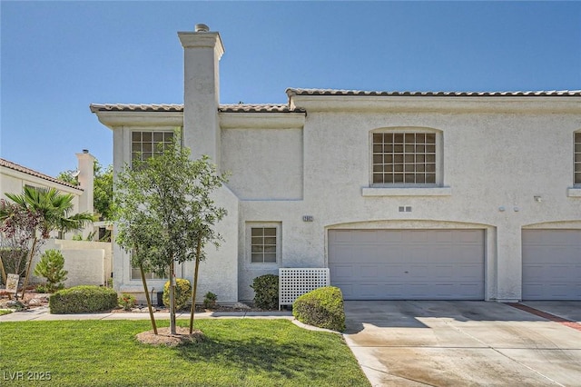 2902 Aztec Lily Ln, Henderson, NV 89074 - view of front of house featuring a garage, stucco siding, driveway, a chimney, and a front yard