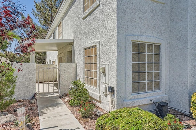 2902 Aztec Lily Ln, Henderson, NV 89074 - entrance to property with stucco siding and a gate