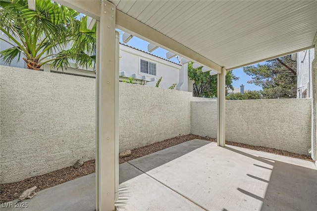 2902 Aztec Lily Ln, Henderson, NV 89074 - fenced backyard with a patio