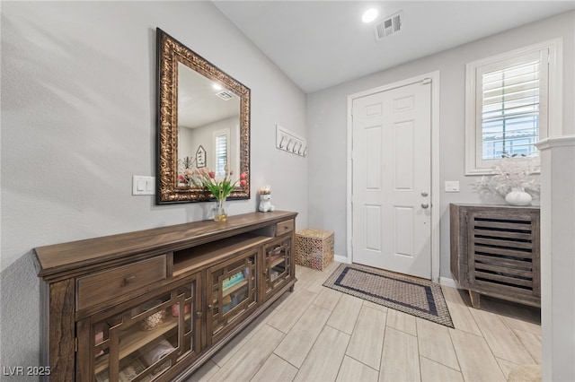 3854 Stadium Ave, Las Vegas, NV 89120 - entrance foyer featuring healthy amount of natural light, baseboards, and light wood-type flooring