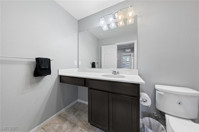 3854 Stadium Ave, Las Vegas, NV 89120 - bathroom featuring toilet, baseboards, and vanity