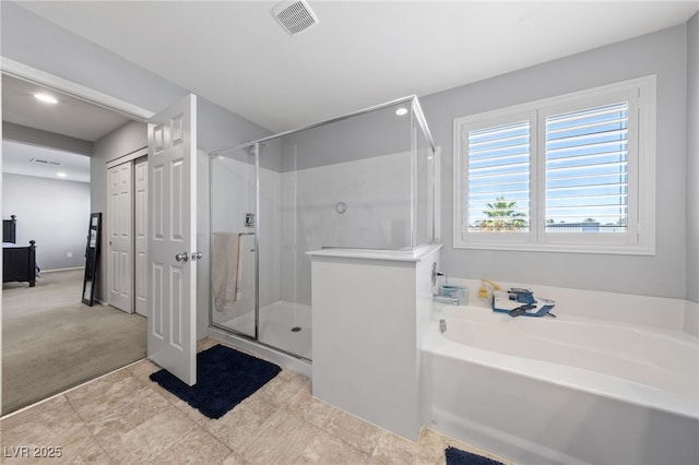 3854 Stadium Ave, Las Vegas, NV 89120 - bathroom featuring a stall shower, a garden tub, and recessed lighting
