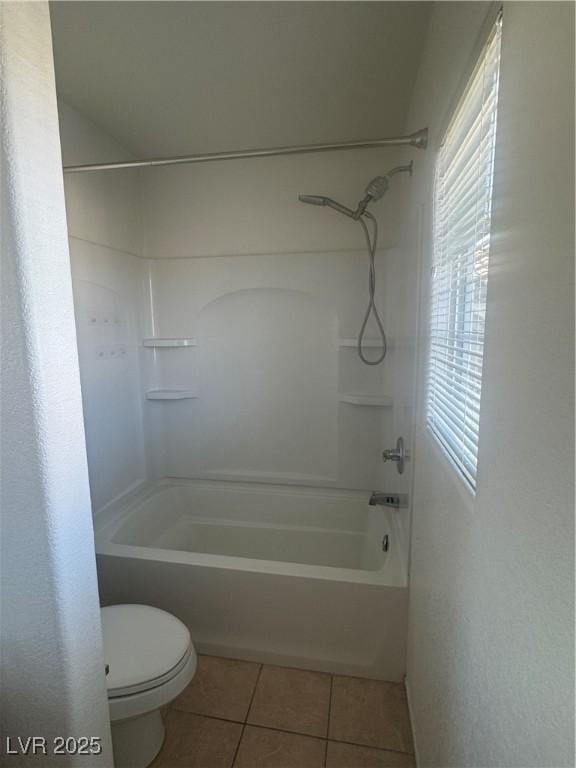 bathroom with tile patterned flooring, toilet, and shower / bathtub combination