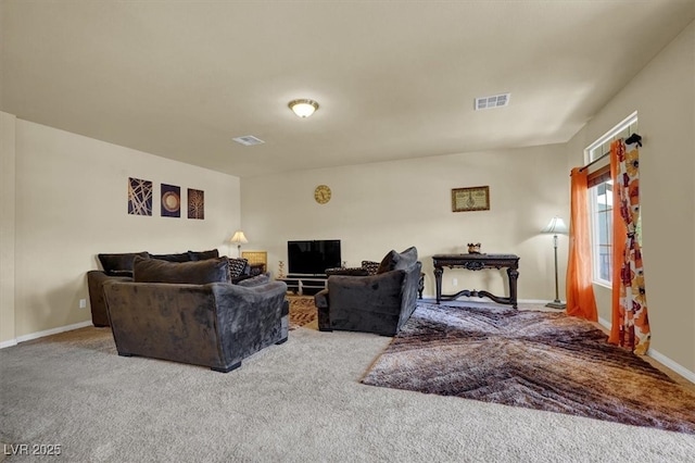 carpeted living area with baseboards