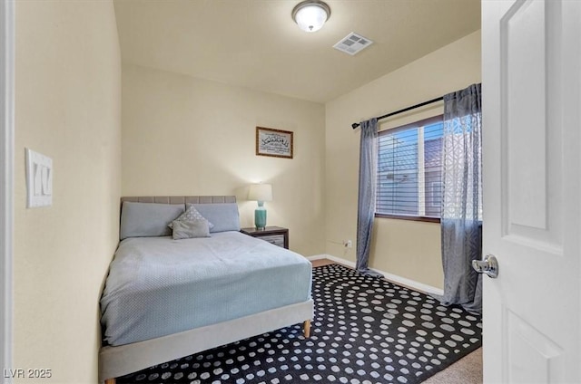 bedroom with carpet and baseboards