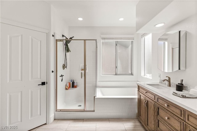 8317 Fritzen Ave, Las Vegas, NV 89131 - full bath with a stall shower, vanity, and tiled tub