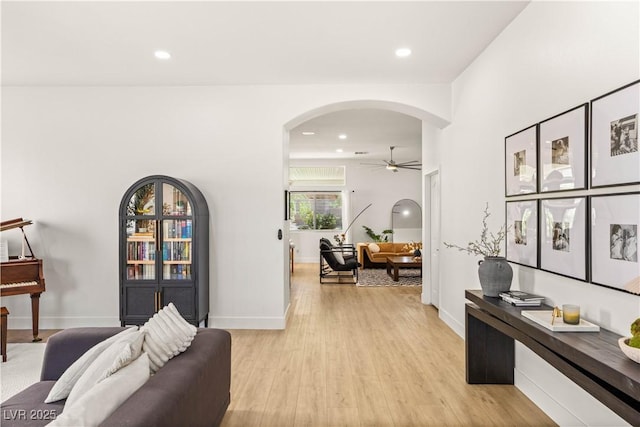 8317 Fritzen Ave, Las Vegas, NV 89131 - corridor with arched walkways, light wood-type flooring, recessed lighting, and baseboards