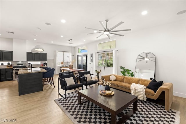 8317 Fritzen Ave, Las Vegas, NV 89131 - living room featuring recessed lighting, light wood-type flooring, and ceiling fan