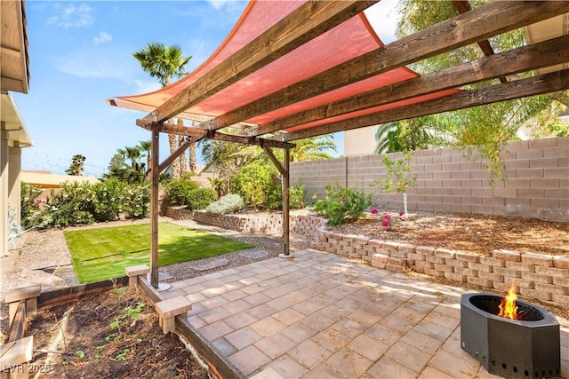 8317 Fritzen Ave, Las Vegas, NV 89131 - view of patio featuring a fenced backyard, a fire pit, and a pergola