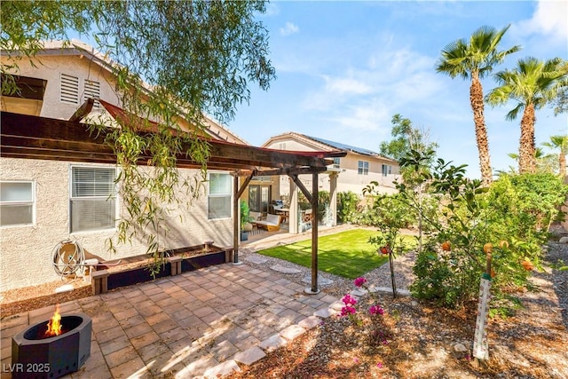 8317 Fritzen Ave, Las Vegas, NV 89131 - view of patio with a pergola and an outdoor fire pit