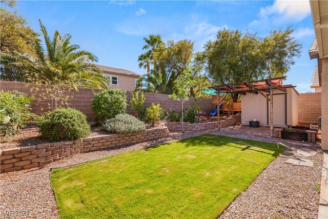 8317 Fritzen Ave, Las Vegas, NV 89131 - view of yard featuring a playground, a shed, and an outbuilding