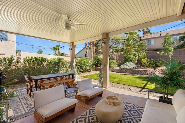 8317 Fritzen Ave, Las Vegas, NV 89131 - view of patio / terrace featuring outdoor dining space, a fenced backyard, and a ceiling fan