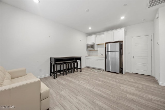 3706 Etendre Ct, Las Vegas, NV 89121 - living area with light wood-style flooring, baseboards, and recessed lighting