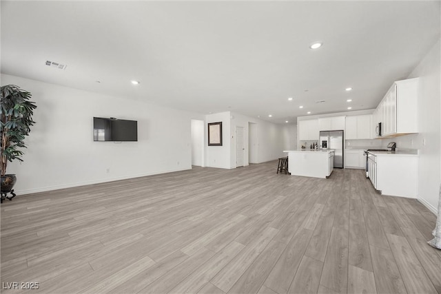 3706 Etendre Ct, Las Vegas, NV 89121 - unfurnished living room with light wood-type flooring and recessed lighting