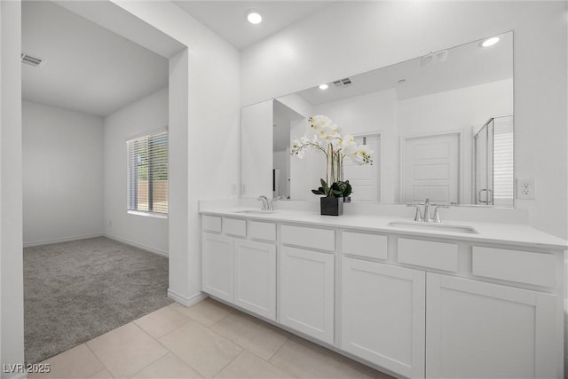 3706 Etendre Ct, Las Vegas, NV 89121 - full bathroom with double vanity, tile patterned flooring, recessed lighting, baseboards, and a shower with door