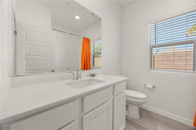 3706 Etendre Ct, Las Vegas, NV 89121 - full bath featuring vanity, toilet, wood finished floors, baseboards, and a shower with shower curtain