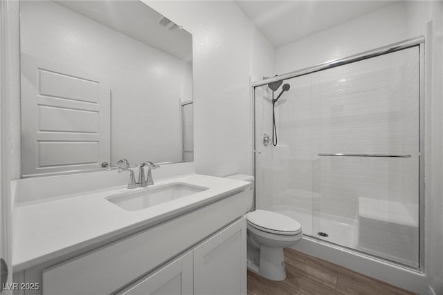 3706 Etendre Ct, Las Vegas, NV 89121 - full bath featuring wood finished floors, toilet, vanity, and a stall shower