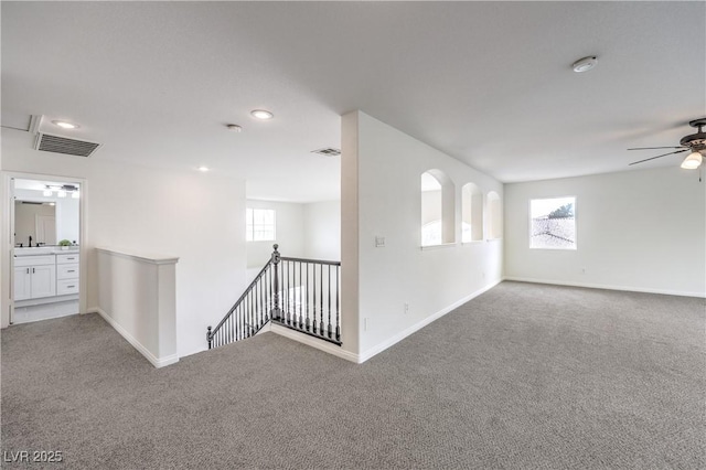 3065 Blue Monaco St, Las Vegas, NV 89117 - carpeted spare room with plenty of natural light, a smoke detector, a ceiling fan, and recessed lighting