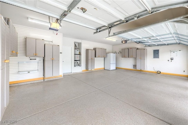 3065 Blue Monaco St, Las Vegas, NV 89117 - garage featuring freestanding refrigerator, a garage door opener, and electric panel