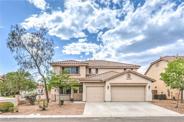 3065 Blue Monaco St, Las Vegas, NV 89117 - mediterranean / spanish-style home featuring stucco siding, a garage, a tiled roof, and driveway