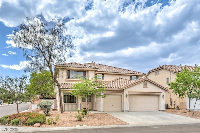 3065 Blue Monaco St, Las Vegas, NV 89117 - mediterranean / spanish-style house with a tile roof, an attached garage, driveway, and stucco siding