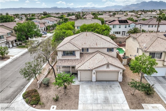 3065 Blue Monaco St, Las Vegas, NV 89117 - view of front of house with stucco siding, a residential view, a tile roof, concrete driveway, and a garage