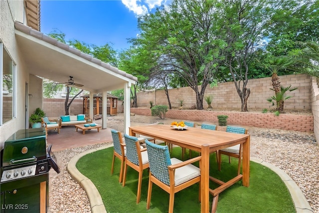 3065 Blue Monaco St, Las Vegas, NV 89117 - fenced backyard featuring outdoor lounge area, a ceiling fan, a patio area, and outdoor dining space