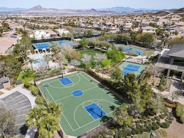 view of sport court with community basketball court, a mountain view, and a residential view
