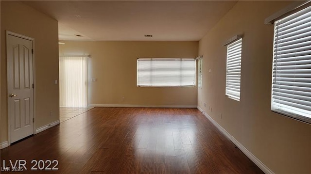 1211 Silver Knoll Ave, Las Vegas, NV 89123 - unfurnished room featuring wood finished floors and baseboards