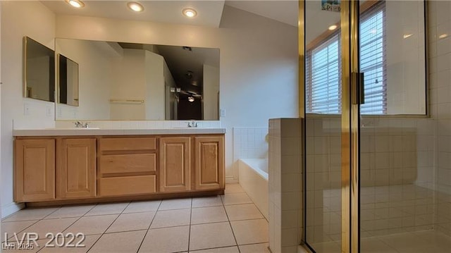 1211 Silver Knoll Ave, Las Vegas, NV 89123 - bathroom with a garden tub, tile patterned floors, double vanity, a shower stall, and lofted ceiling