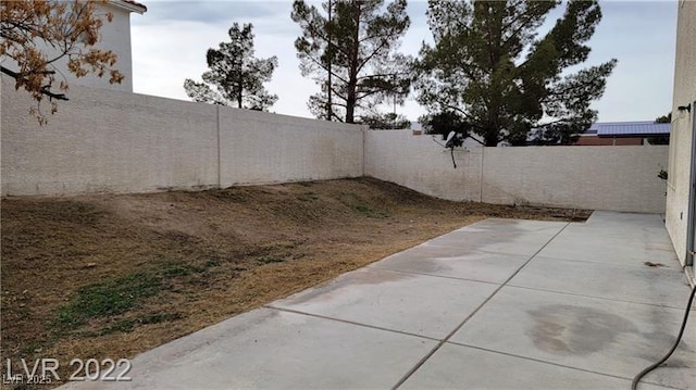 1211 Silver Knoll Ave, Las Vegas, NV 89123 - fenced backyard with a patio area