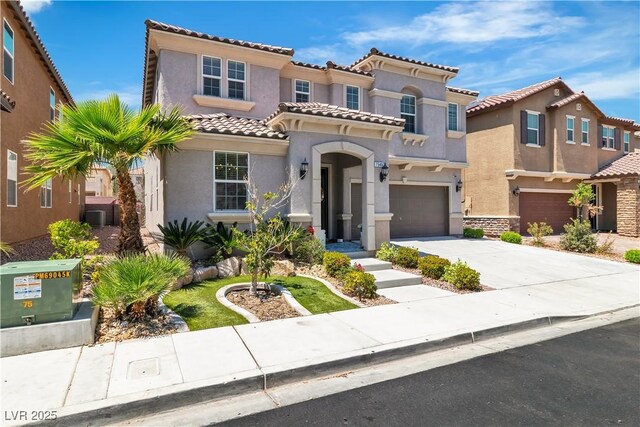 7545 Fontera Ct, Las Vegas, NV 89139 - mediterranean / spanish house with an attached garage, stucco siding, driveway, and a tile roof