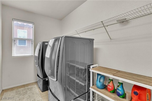 7545 Fontera Ct, Las Vegas, NV 89139 - laundry room featuring washing machine and dryer, baseboards, and tile patterned flooring