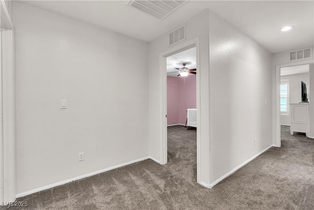 7545 Fontera Ct, Las Vegas, NV 89139 - hallway featuring carpet flooring, baseboards, and radiator