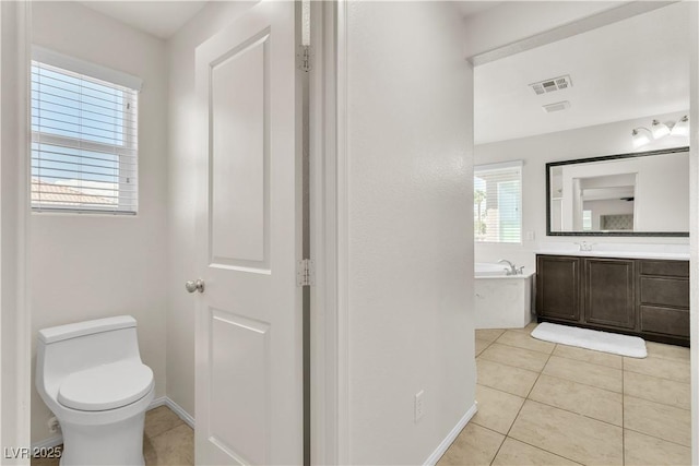 7545 Fontera Ct, Las Vegas, NV 89139 - bathroom with a bath, tile patterned floors, toilet, and vanity