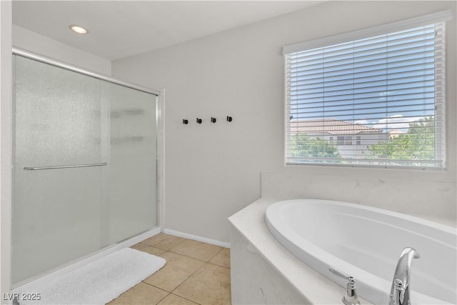 7545 Fontera Ct, Las Vegas, NV 89139 - full bath with a stall shower, tile patterned floors, a bath, and plenty of natural light